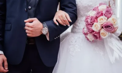 Noivo e noiva durante casamento Foto Canva Pro